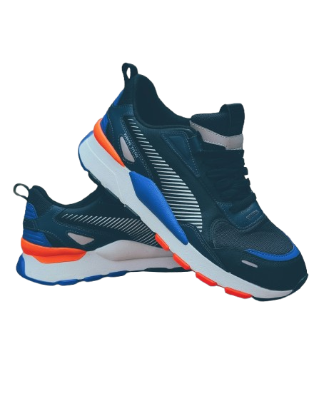 Close-up of modern sneakers with textured fabric and oversized sole design under soft lighting
